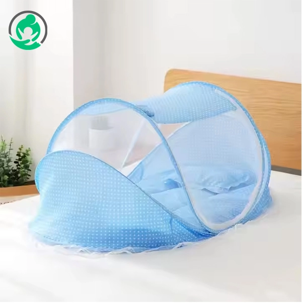Happy baby playing inside the colorful mosquito net – safe and fun indoor setup.